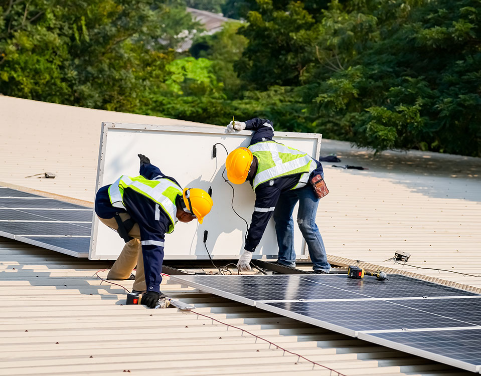 Commercial Solar Installer Team Installing Rooftop Solar System
